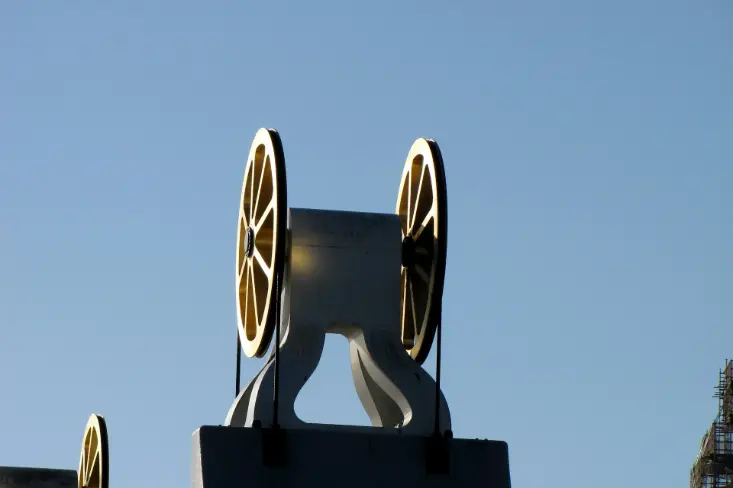 a close up of a clock tower with a sky background